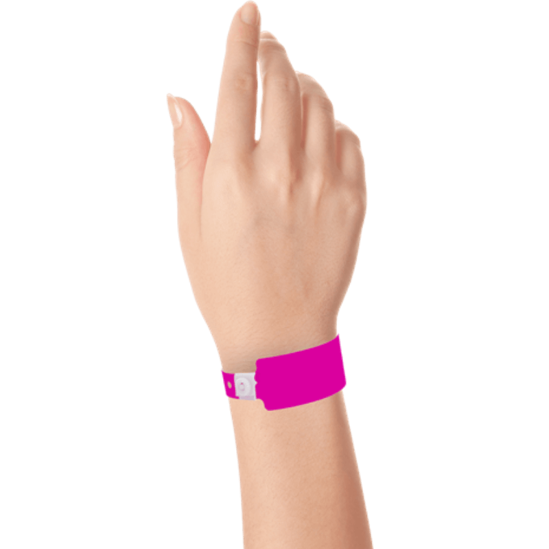 Wide face plastic solid wristband on hand in neon pink
