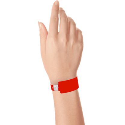 Wide face plastic solid wristband on hand in neon red