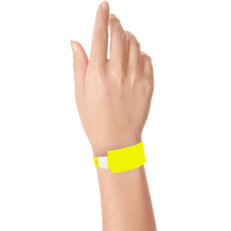 Wide face plastic solid wristband on hand in neon yellow