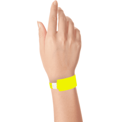 Wide face plastic solid wristband on hand in neon yellow