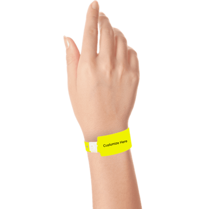 wide face plastic wristbands with a placeholder to show where you can customize the wristband on hand in neon yellow
