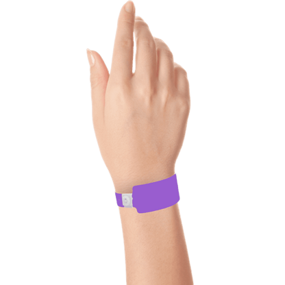 Wide face plastic solid wristband on hand in purple