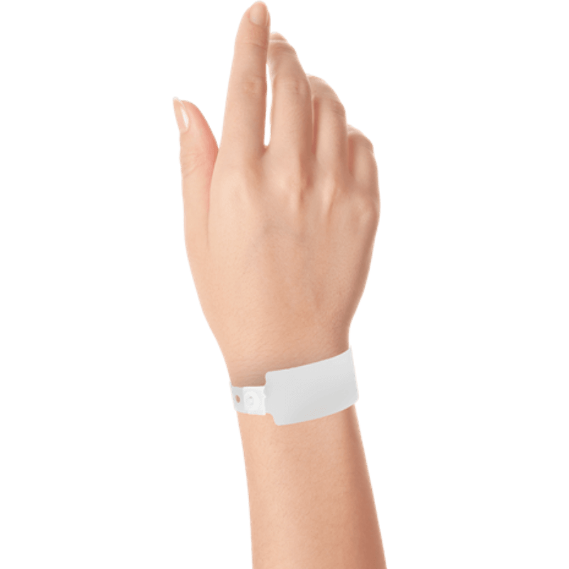 Wide face plastic solid wristband on hand in white