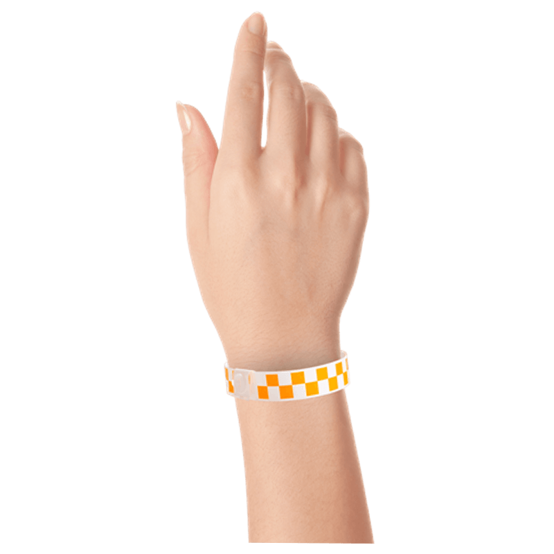 Plastic checkerboard wristband on hand in neon orange