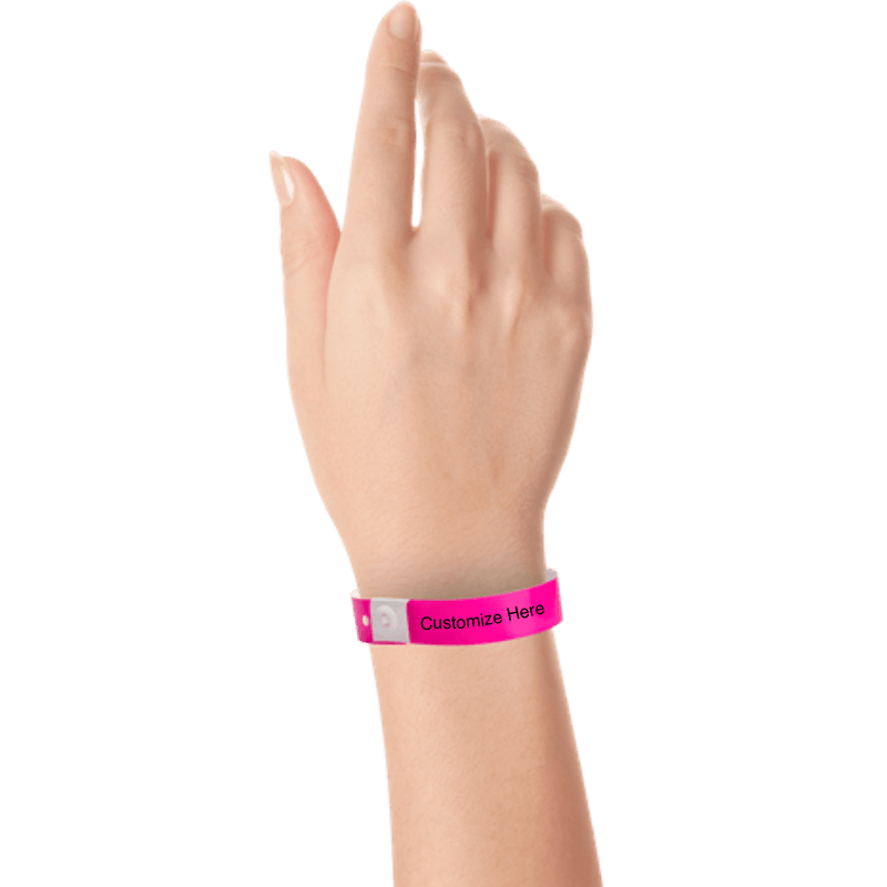 hand wearing plastic regular 3/4" wristband with a placeholder to show where you can customize the wristband in neon pink