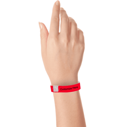 hand wearing plastic regular 3/4" wristband with a placeholder to show where you can customize the wristband in neon red