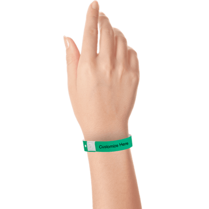 hand wearing plastic regular 3/4" wristband with a placeholder to show where you can customize the wristband in pantone green