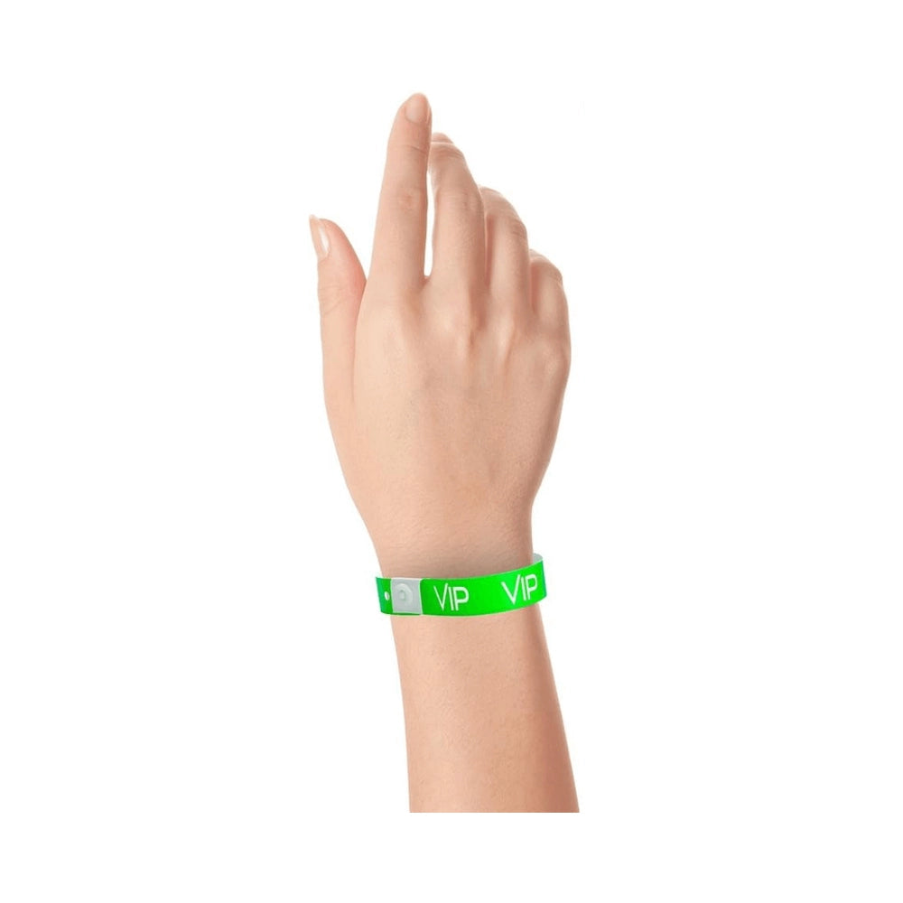 green plastic wristband with text "VIP" printed in white across the wristband - shown on wrist