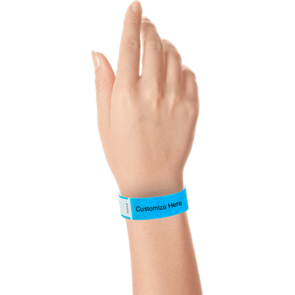 hand wearing tyvek 3/4" solid qwik fit wristband showing a placeholder for customization in neon blue
