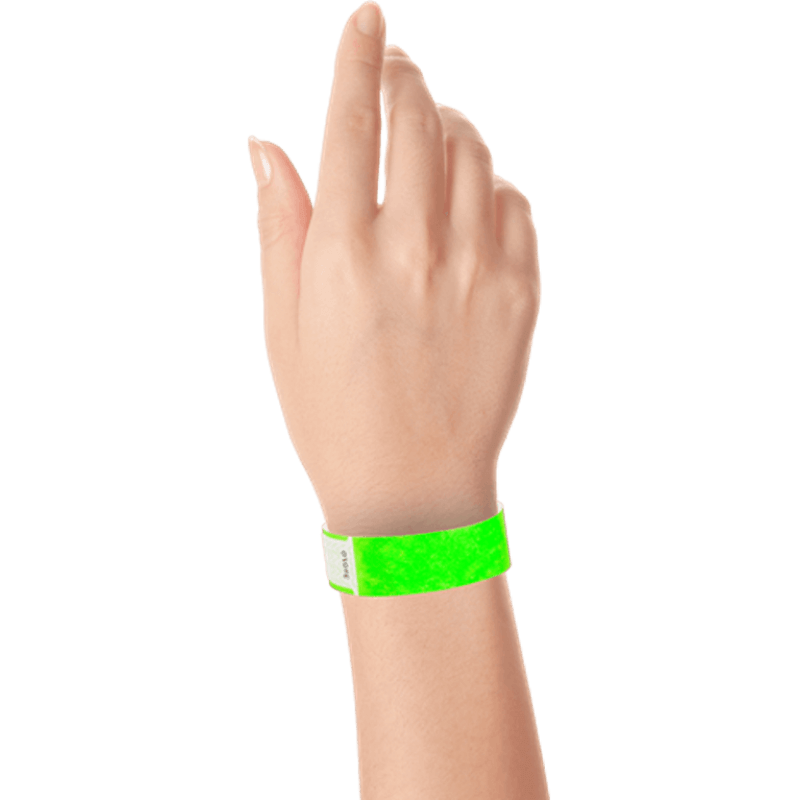 hand wearing tyvek 3/4" solid qwik fit wristband in neon green