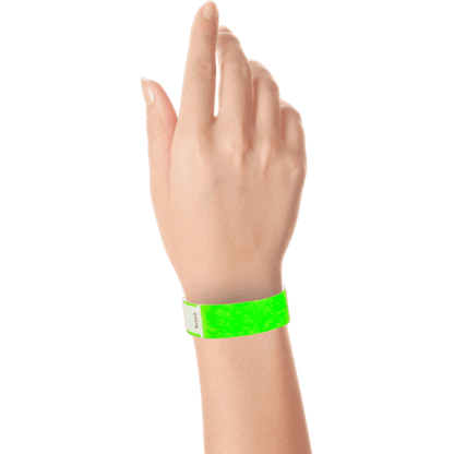 hand wearing tyvek 3/4" solid qwik fit wristband in neon green
