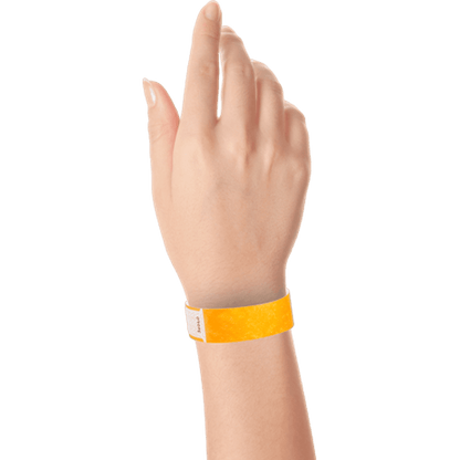 hand wearing tyvek 3/4" solid qwik fit wristband in neon orange