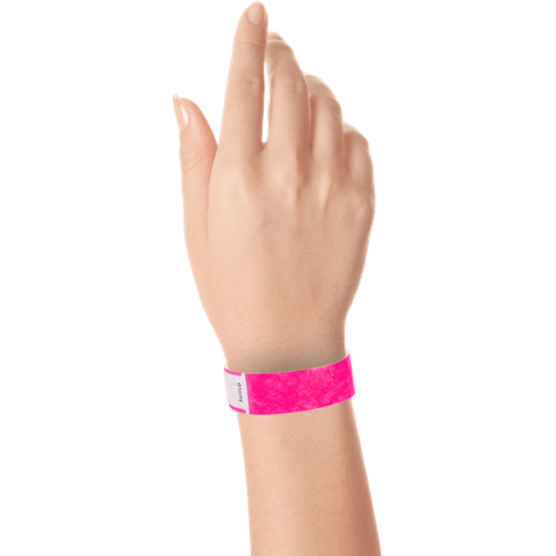 hand wearing tyvek 3/4" solid qwik fit wristband in neon pink