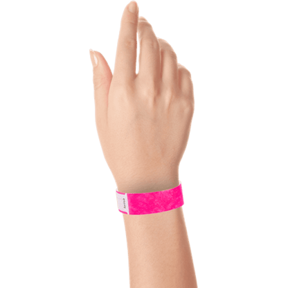 hand wearing tyvek 3/4" solid qwik fit wristband in neon pink