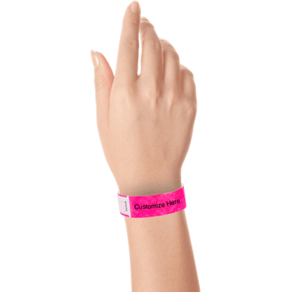 hand wearing tyvek 3/4" solid qwik fit wristband showing a placeholder for customization in neon pink