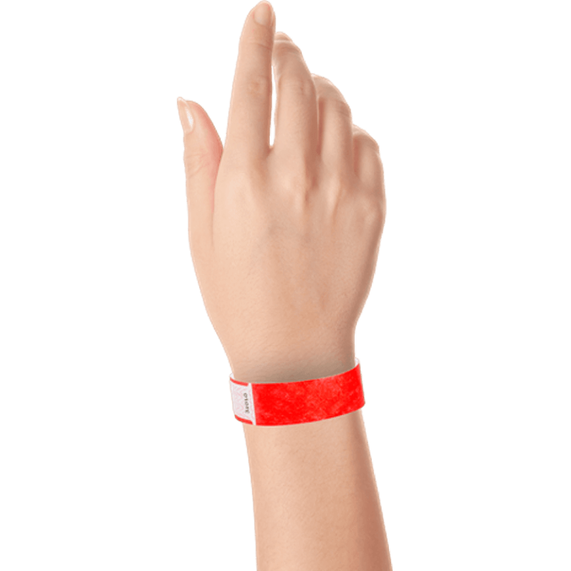 hand wearing tyvek 3/4" solid qwik fit wristband in neon red