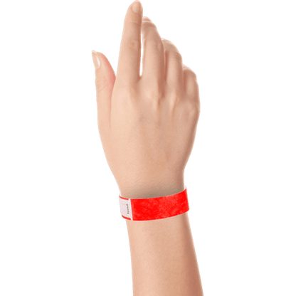 hand wearing tyvek 3/4" solid qwik fit wristband in neon red