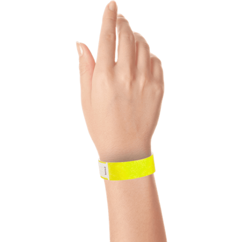 hand wearing tyvek 3/4" solid qwik fit wristband in neon yellow