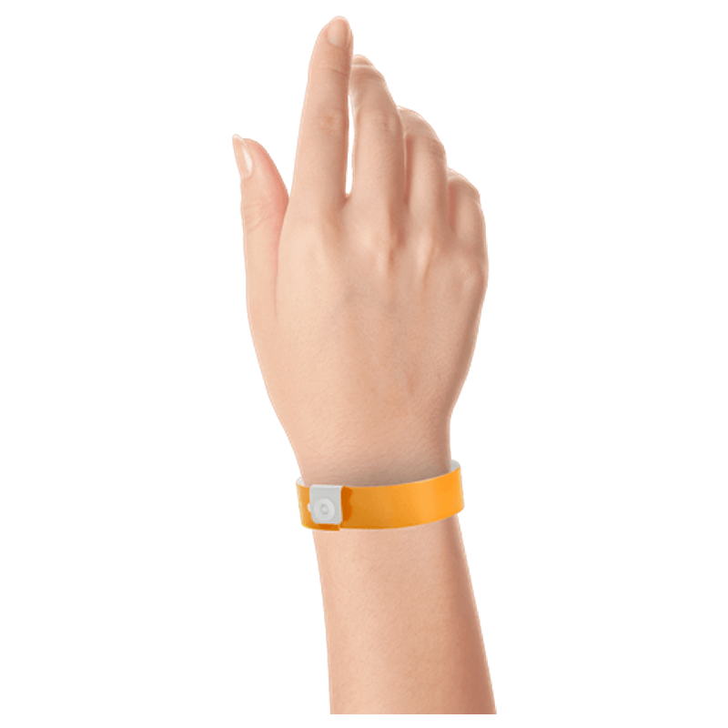 Regular vinyl wristband on hand in neon orange