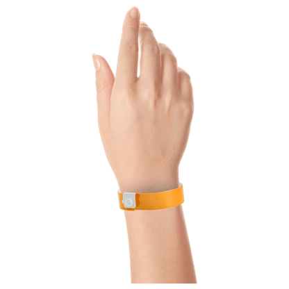 Regular vinyl wristband on hand in neon orange