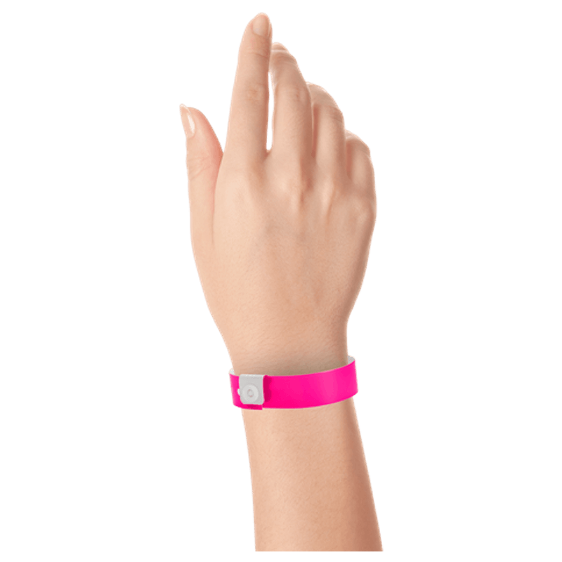 Regular vinyl wristband on hand in neon pink