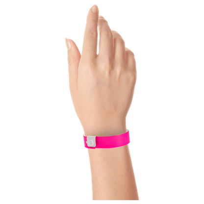 Regular vinyl wristband on hand in neon pink