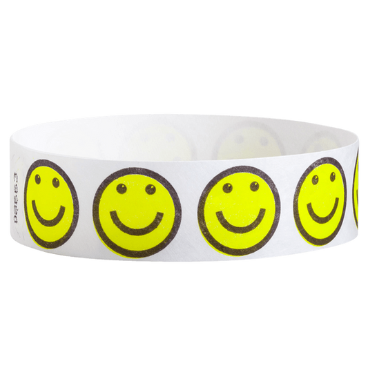white tyvek Wristband with neon yellow smiley face designs outlined in black - round version shown