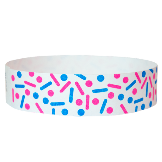 white tyvek wristband with neon pink and neon blue dots and lines - sprinkles - round version shown