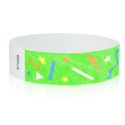neon green wristband with geometric shapes in neon blue, neon orange, neon yellow and white - round version shown