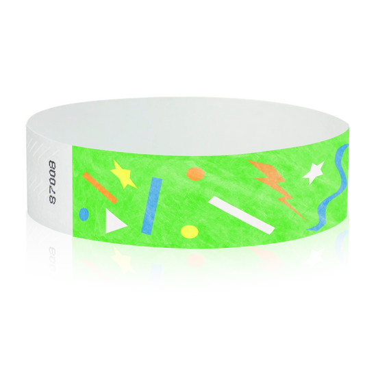 neon green wristband with geometric shapes in neon blue, neon orange, neon yellow and white - round version shown