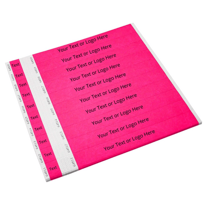 Showing sheets of tyvek 1" detachable stub wristbands in neon pink