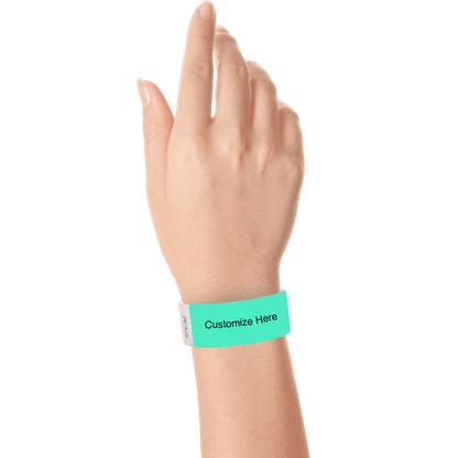 hand wearing a aqua tyvek 1" solid wristband with a placeholder to customize with your text or logo