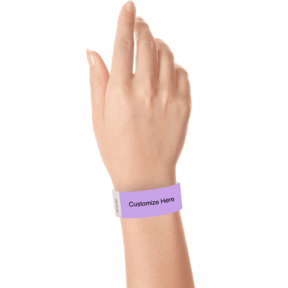 hand wearing a berry tyvek 1" solid wristband with a placeholder to customize with your text or logo