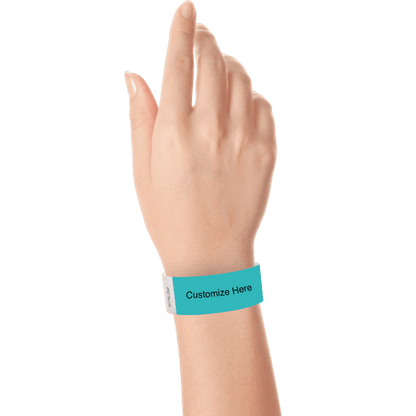 hand wearing a carribean blue tyvek 1" solid wristband with a placeholder to customize with your text or logo