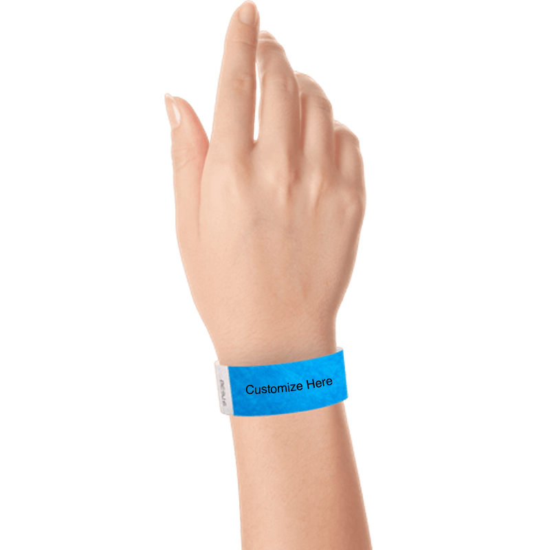 hand wearing a neon blue tyvek 1" solid wristband with a placeholder to customize with your text or logo