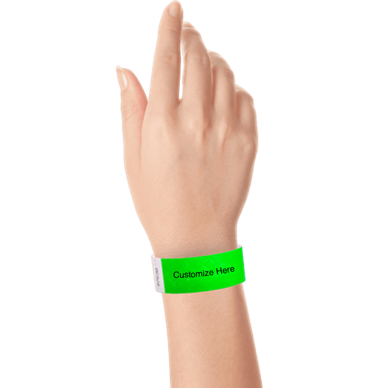 hand wearing a neon green tyvek 1" solid wristband with a placeholder to customize with your text or logo