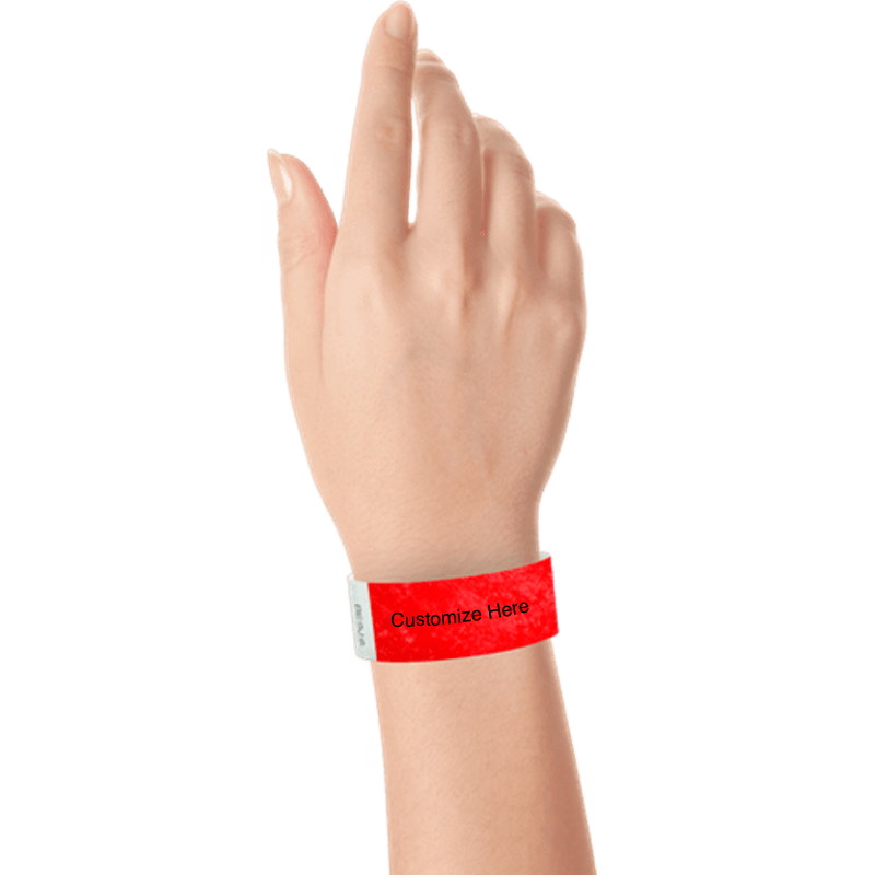 hand wearing a neon red tyvek 1" solid wristband with a placeholder to customize with your text or logo