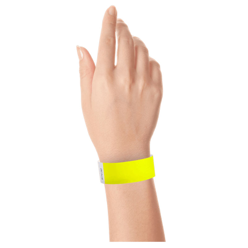 neon yellow tyvek 1" solid wristband on hand