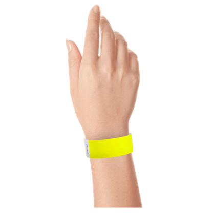 neon yellow tyvek 1" solid wristband on hand