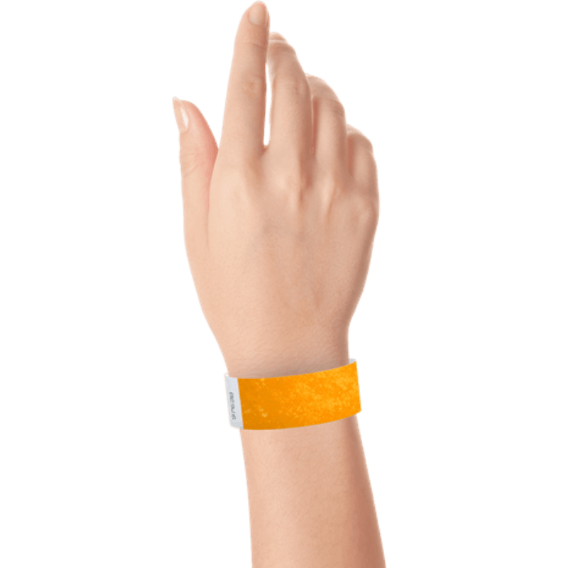 neon orange tyvek 1" solid wristband on hand 