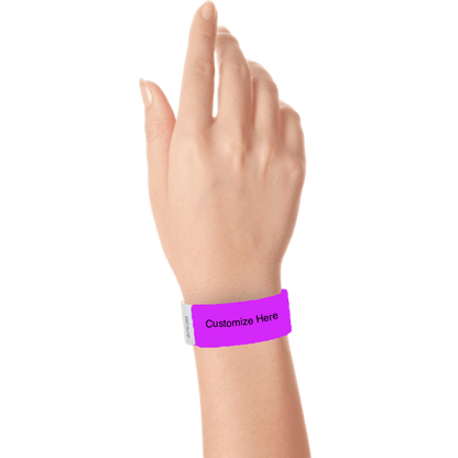 hand wearing a pantone purple tyvek 1" solid wristband with a placeholder to customize with your text or logo 