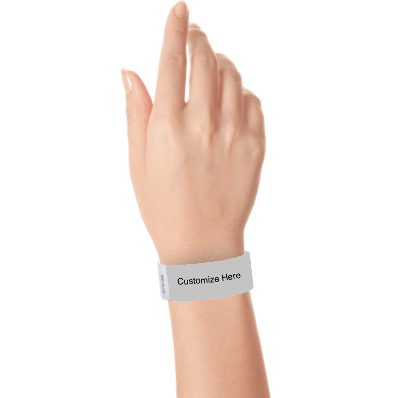 hand wearing a silver tyvek 1" solid wristband with a placeholder to customize with your text or logo