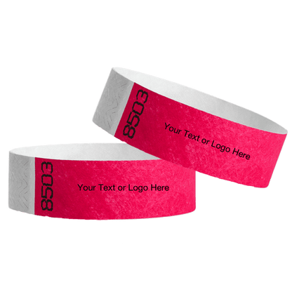 two neon pink tyvek 3/4" wristbands showing duplicate numbers with a placeholder to customize your text or logo