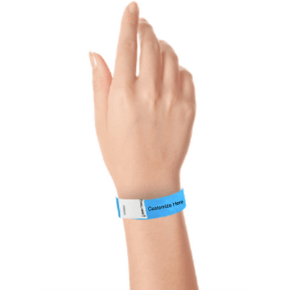 hand wearing a neon blue tyvek 3/4" litter free wristband with a placeholder for customizing with your text or logo