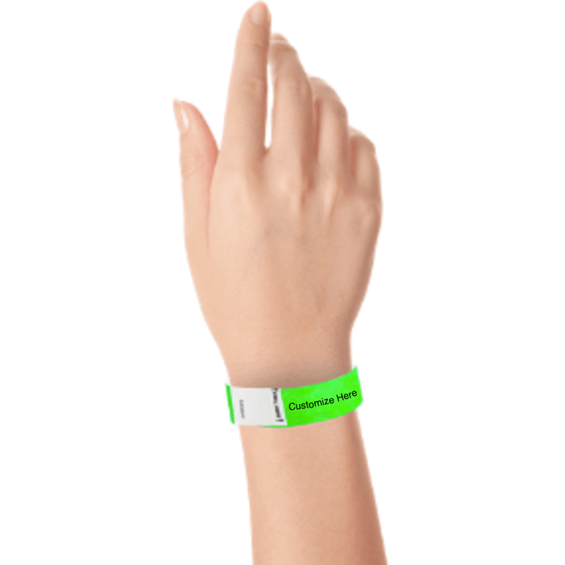 hand wearing a neon green tyvek 3/4" litter free wristband with a placeholder for customizing with your text or logo