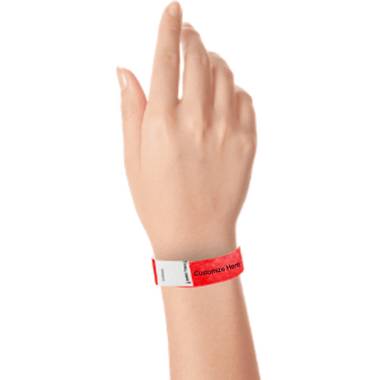 hand wearing a neon red tyvek 3/4" litter free wristband with a placeholder for customizing with your text or logo