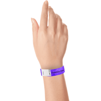 hand wearing a purple tyvek 3/4" litter free wristband with a placeholder for customizing with your text or logo