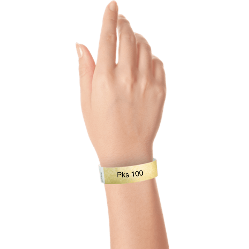 a hand wearing tyvek 3/4" wristband solid gold pks 100