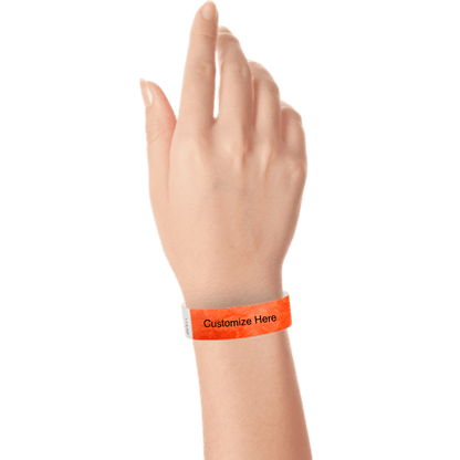 wrist wearing tyvek 3/4" solid wristband showing placeholder for customization in coral red