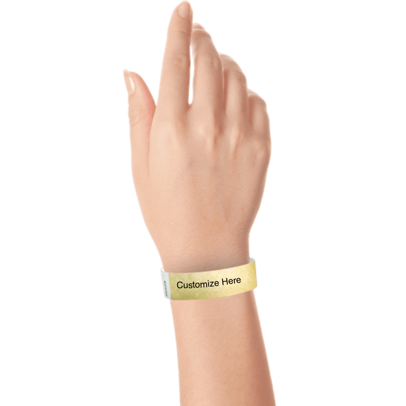 wrist wearing tyvek 3/4" solid wristband showing placeholder for customization in gold
